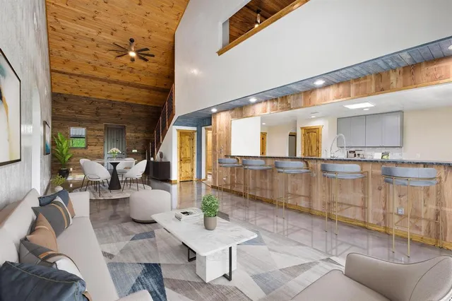 a lobby with furniture and a rug