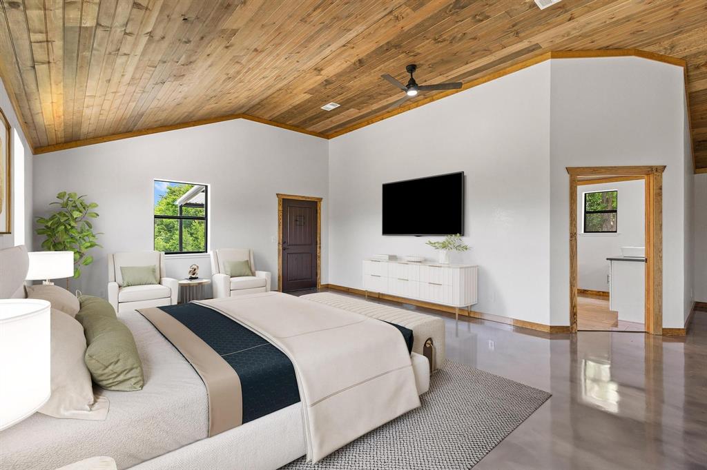 516 County Road Honey Grove, TX 75446 - Photo 5 of 27 a bedroom with a bed and a flat screen tv