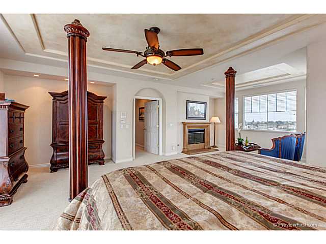 1740 Dylan Way Encinitas, CA 92024 - Photo 18 of 25 Master bedroom with sitting area and fireplace
