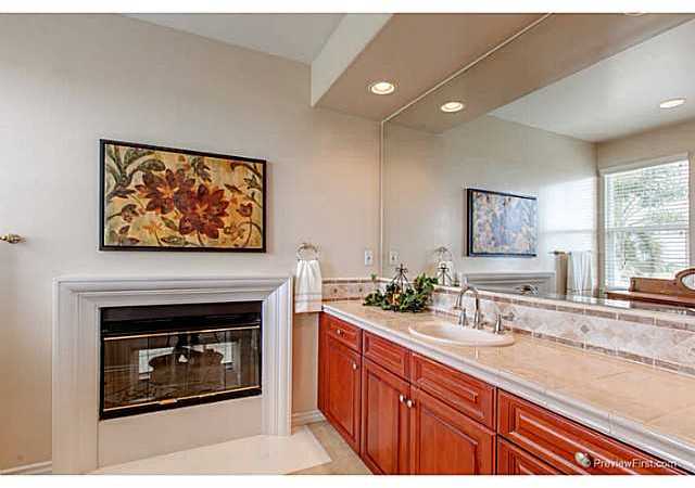 1740 Dylan Way Encinitas, CA 92024 - Photo 20 of 25 Master bath with shared fireplace