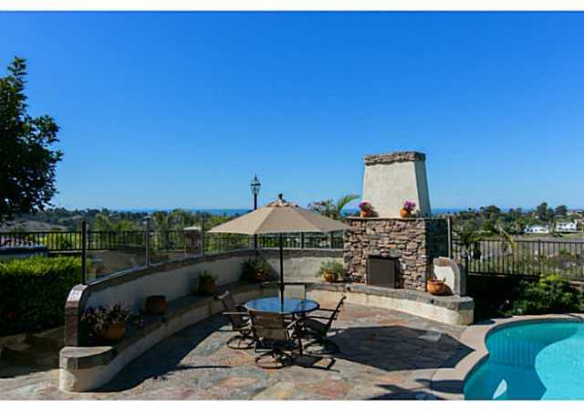 1740 Dylan Way Encinitas, CA 92024 - Photo 23 of 25 Fireplace, pool, spa, waterfall, covered patio and ocean view