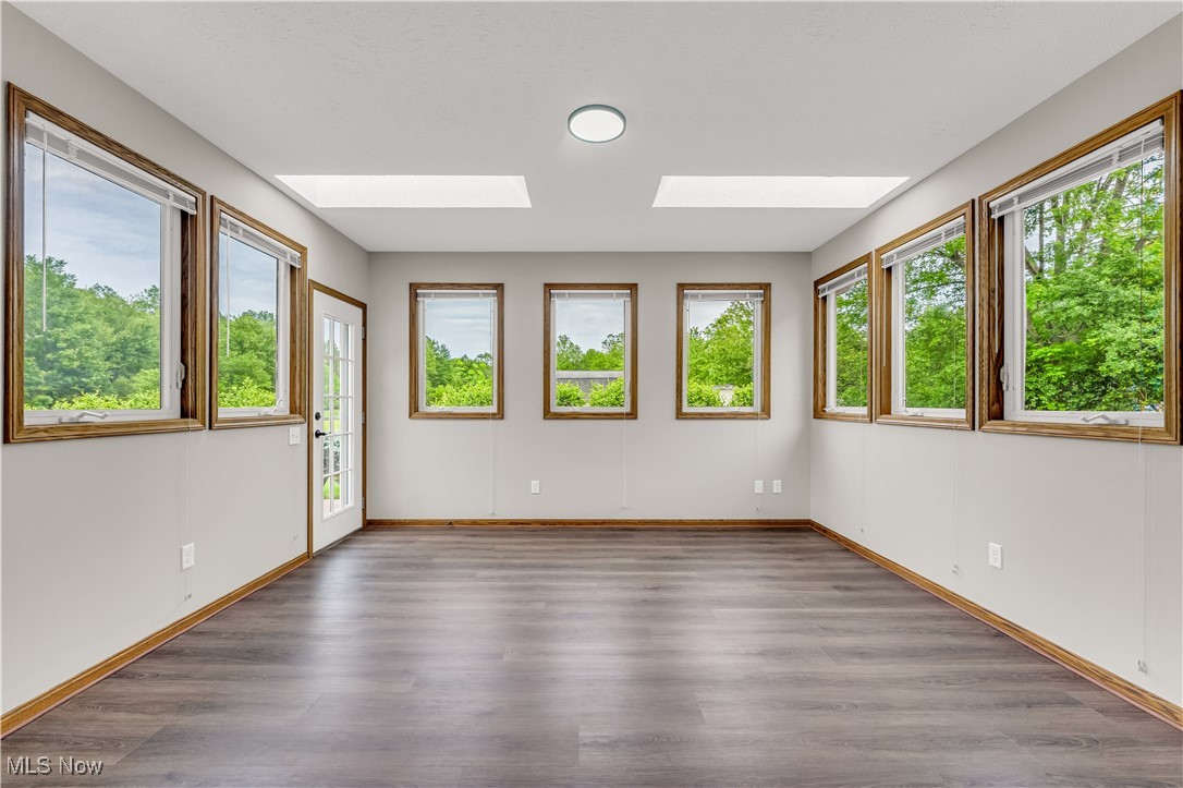 5327 Jaycox Road North Ridgeville, OH 44039 - Photo 16 of 36 Unfurnished room with a skylight, lvp finished floors, and baseboards