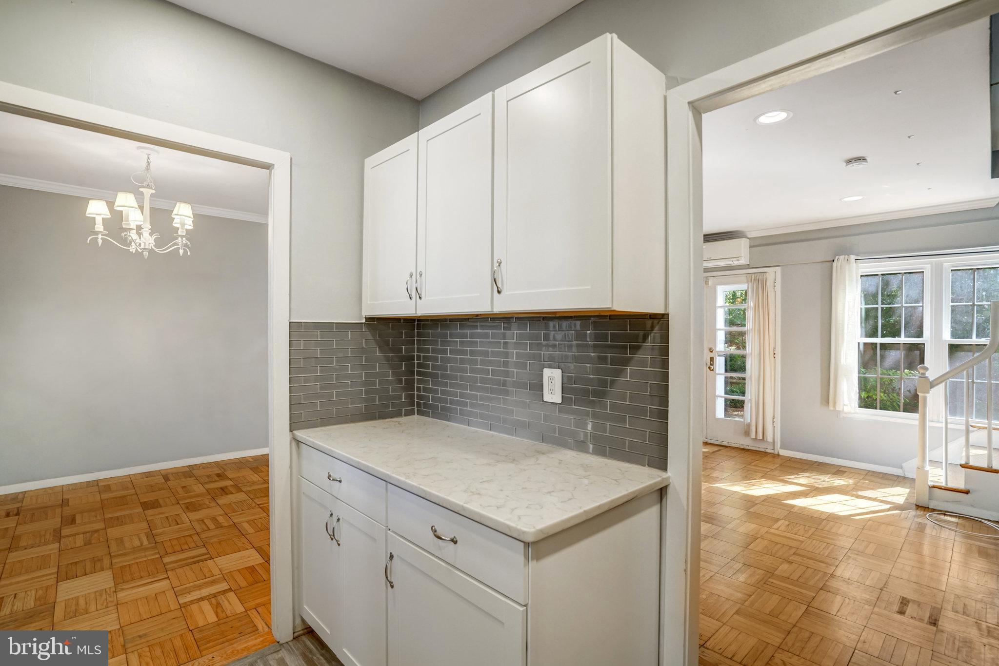 3239 Gunston Road Alexandria, VA 22302 - Photo 12 of 58 a kitchen with a sink and cabinets