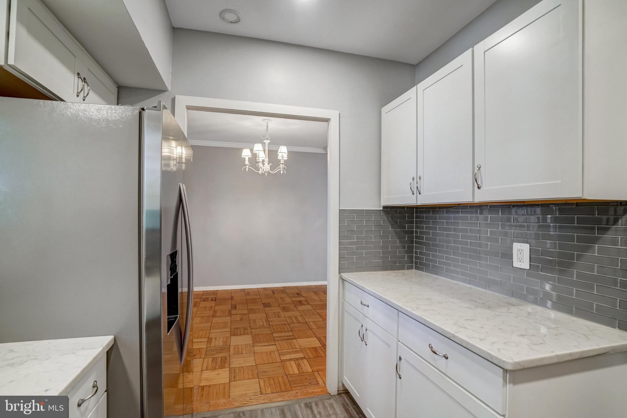 3239 Gunston Road Alexandria, VA 22302 - Photo 13 of 58 a kitchen with a sink and refrigerator