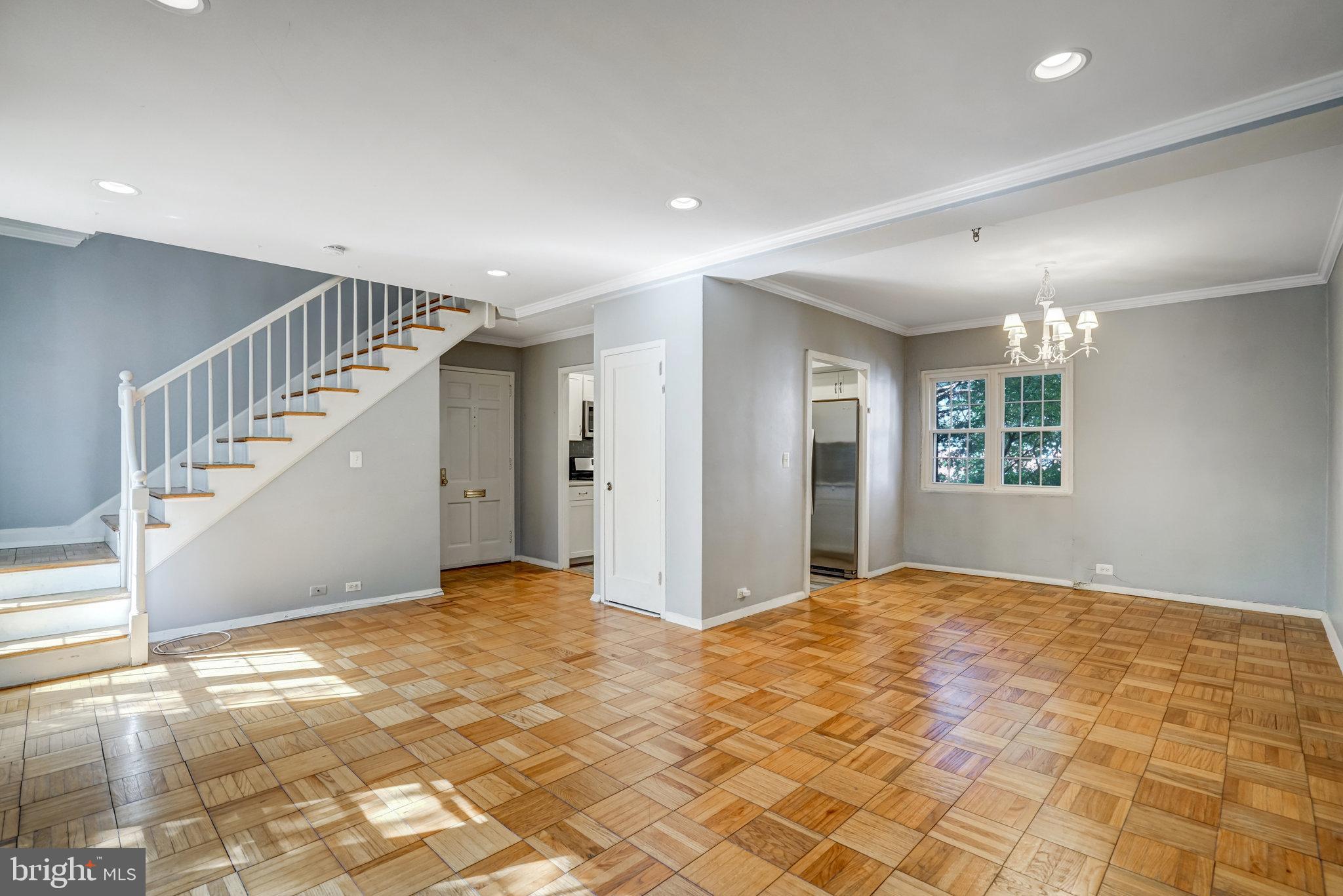3239 Gunston Road Alexandria, VA 22302 - Photo 14 of 58 a view of an empty room with stairs and a window