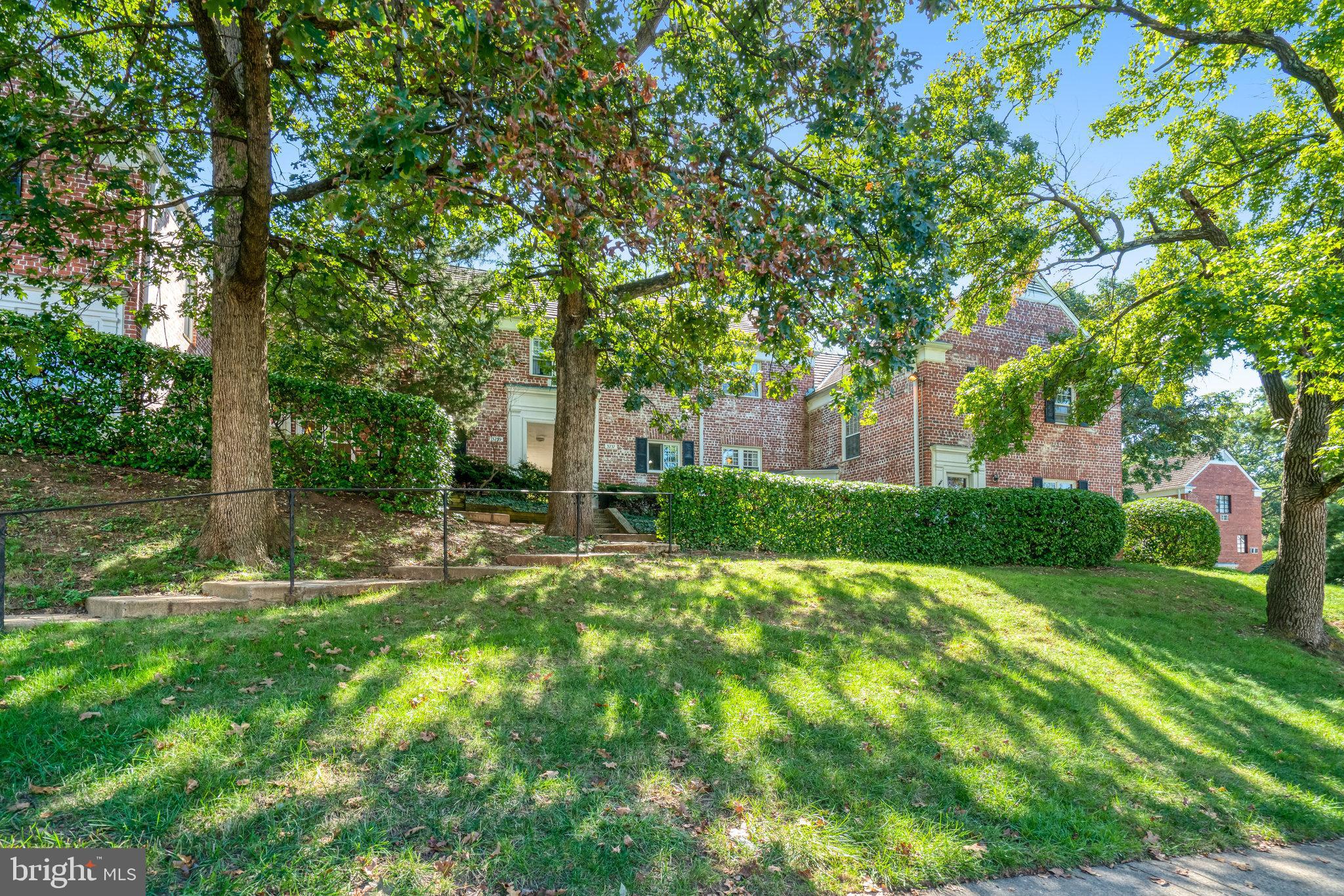 3239 Gunston Road Alexandria, VA 22302 - Photo 2 of 58 a view of backyard with fountain and large trees