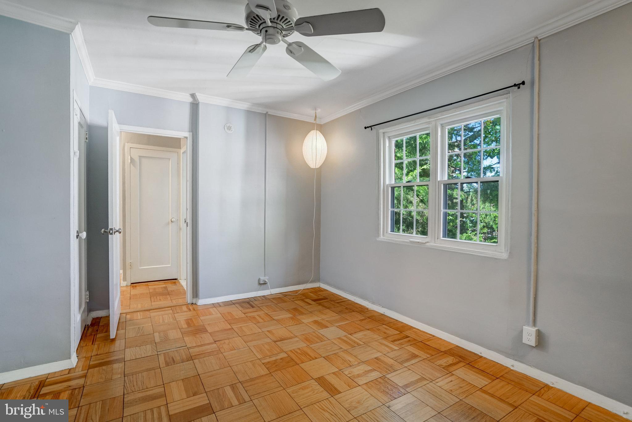 3239 Gunston Road Alexandria, VA 22302 - Photo 32 of 58 a view of an empty room and window and chandelier fan