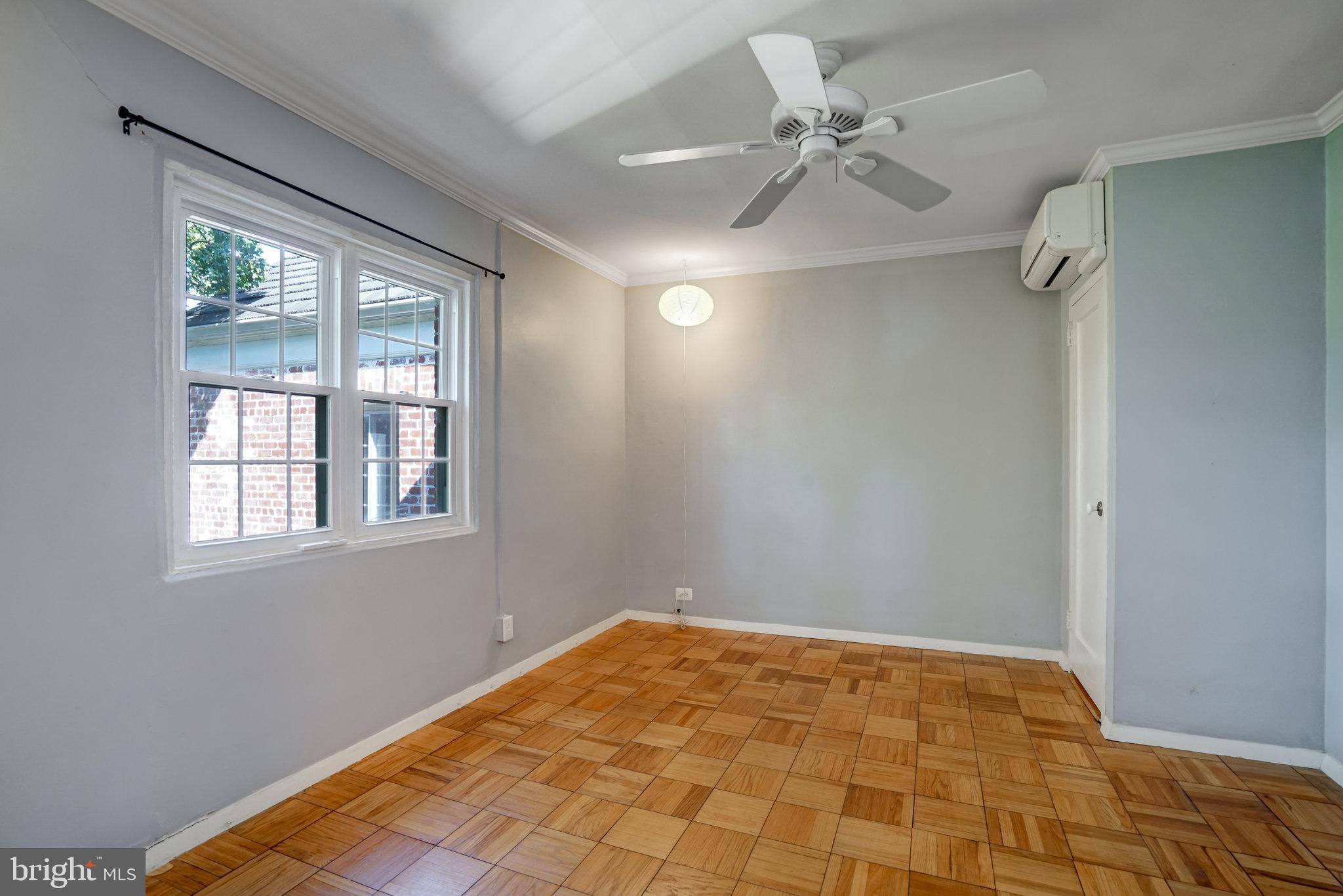 3239 Gunston Road Alexandria, VA 22302 - Photo 35 of 58 a view of a room with a ceiling fan and a window
