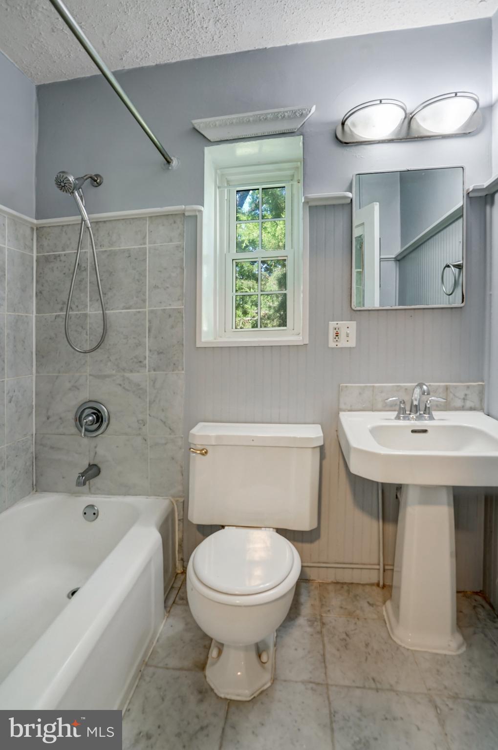 3239 Gunston Road Alexandria, VA 22302 - Photo 43 of 58 a bathroom with a sink a toilet and shower