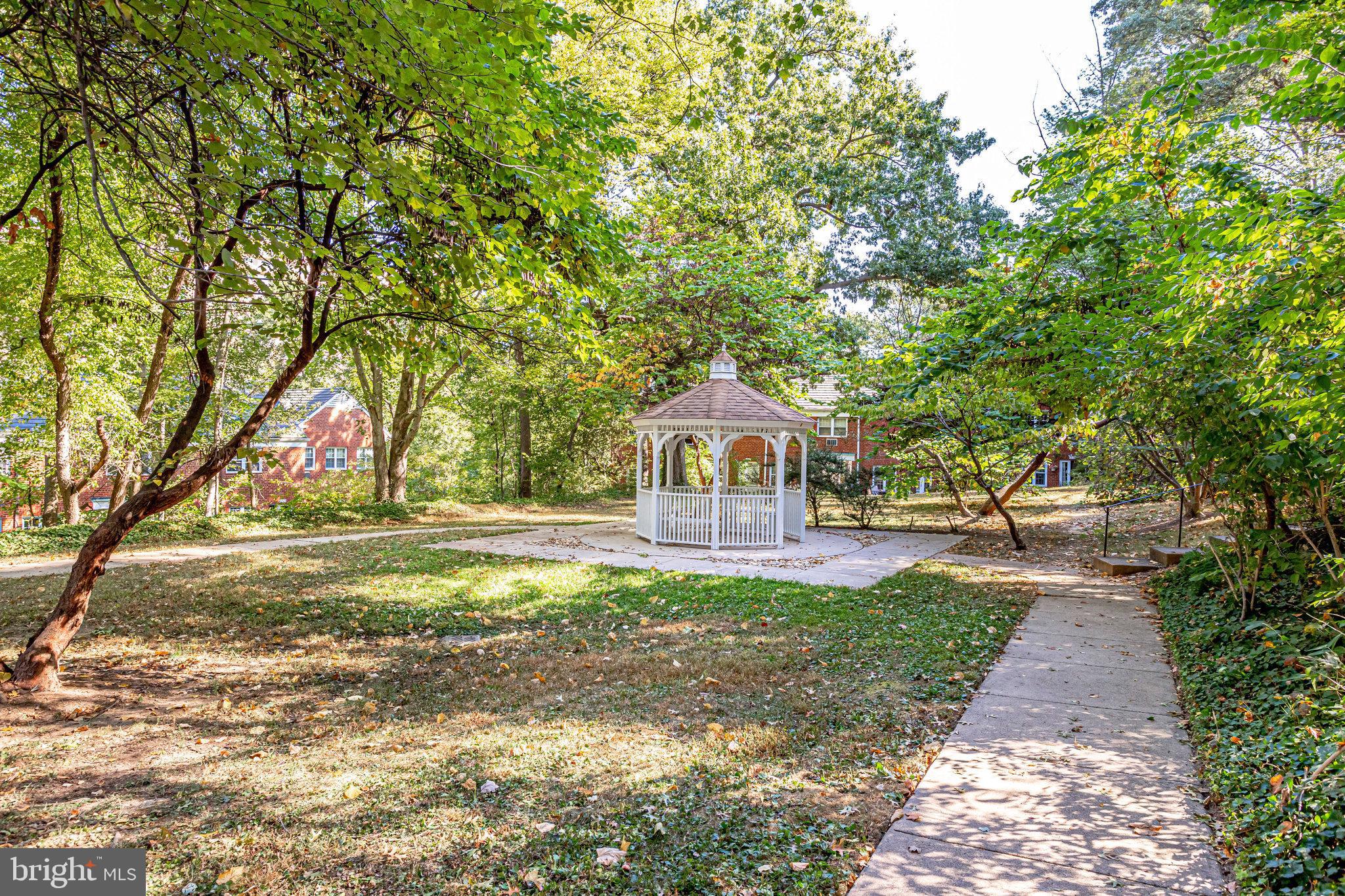 3239 Gunston Road Alexandria, VA 22302 - Photo 55 of 58 a front view of a house with a yard