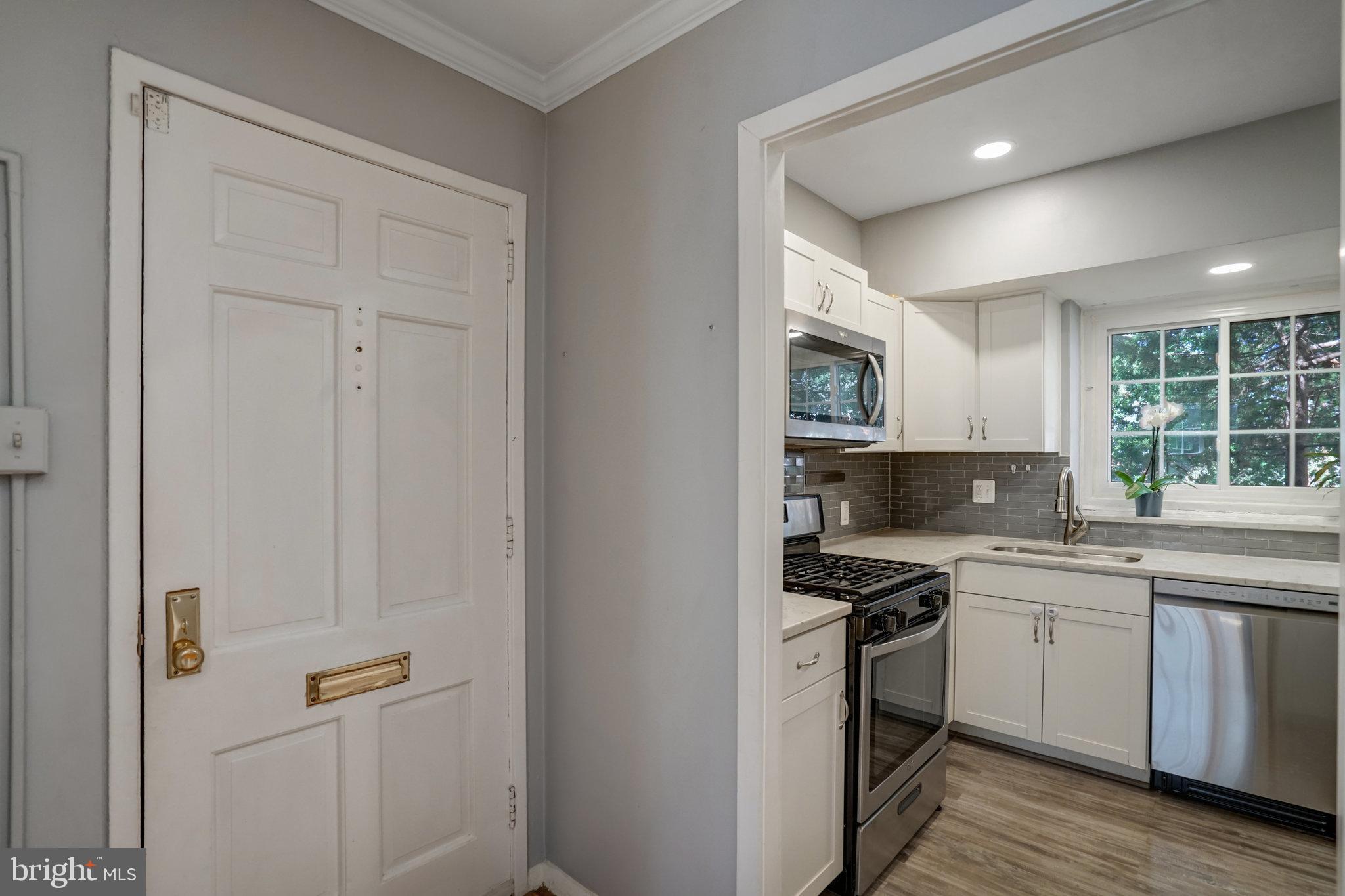 3239 Gunston Road Alexandria, VA 22302 - Photo 6 of 58 a kitchen with a sink appliances and cabinets