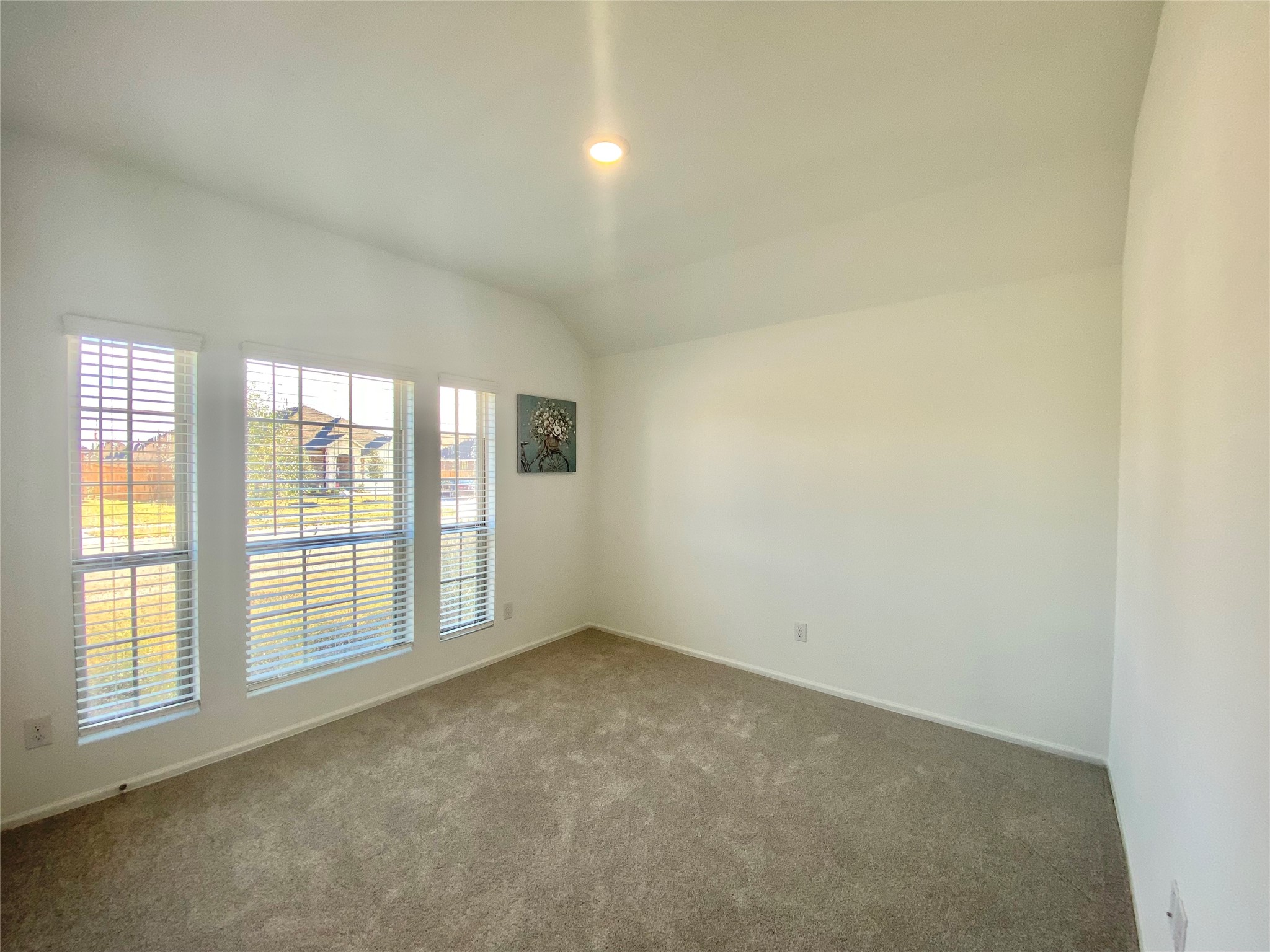 3724 Moss Hl Road Rosenberg, TX 77469 - Photo 21 of 29 Bright room with large windows and neutral walls, featuring soft carpeting. Ideal for a cozy bedroom or home office.