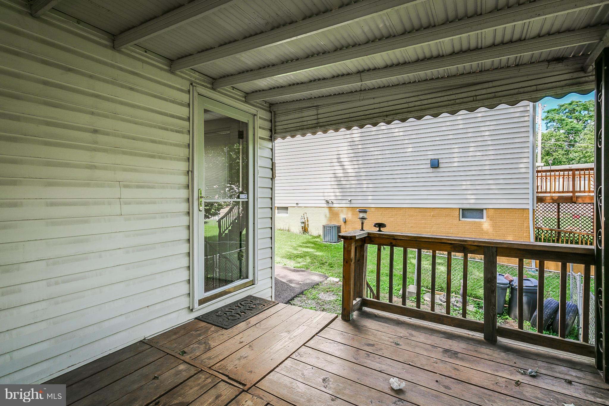 4117 Old Washington Road Baltimore, MD 21227 - Photo 23 of 27 a view of a porch with a table and chairs