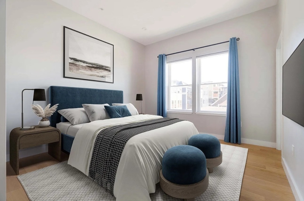 243 Condor Street, Unit 4 Boston, MA 02128 - Photo 7 of 13 a bed room with bed and a window