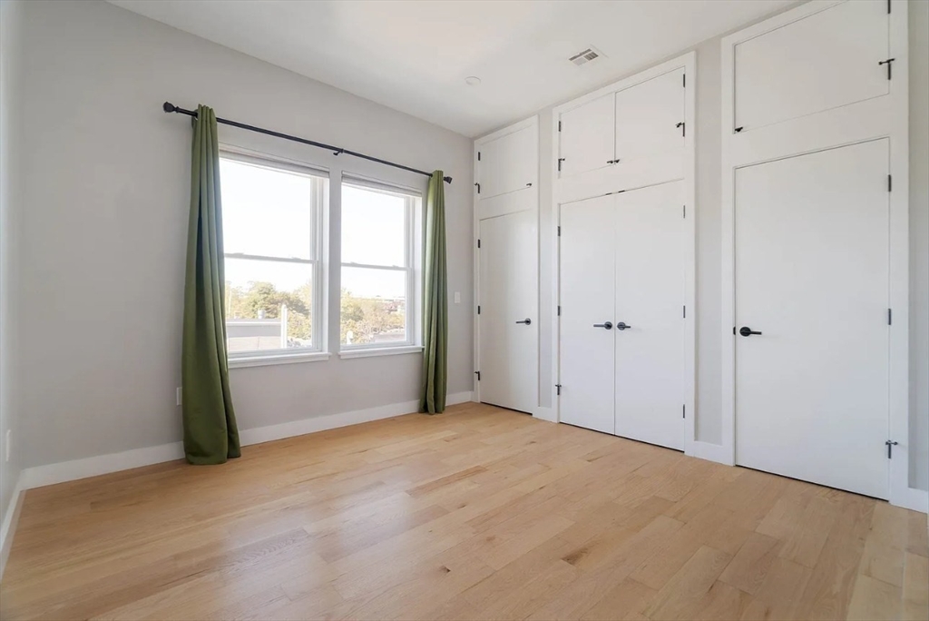 243 Condor Street, Unit 4 Boston, MA 02128 - Photo 9 of 13 a view of an empty room with a window