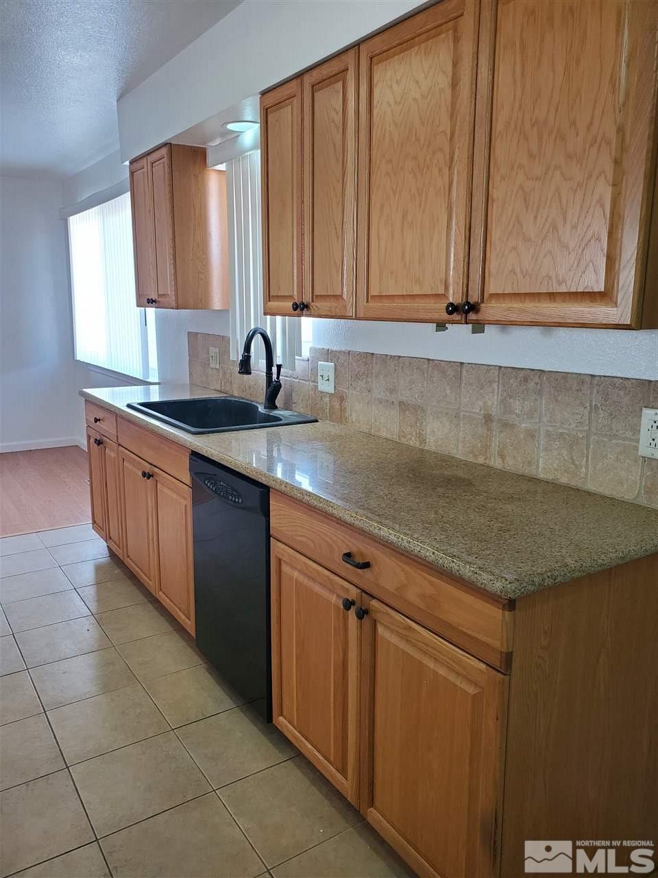 2780 Rice Road Fallon, NV 89406 - Photo 5 of 21 a kitchen with stainless steel appliances granite countertop a sink a stove and dishwasher