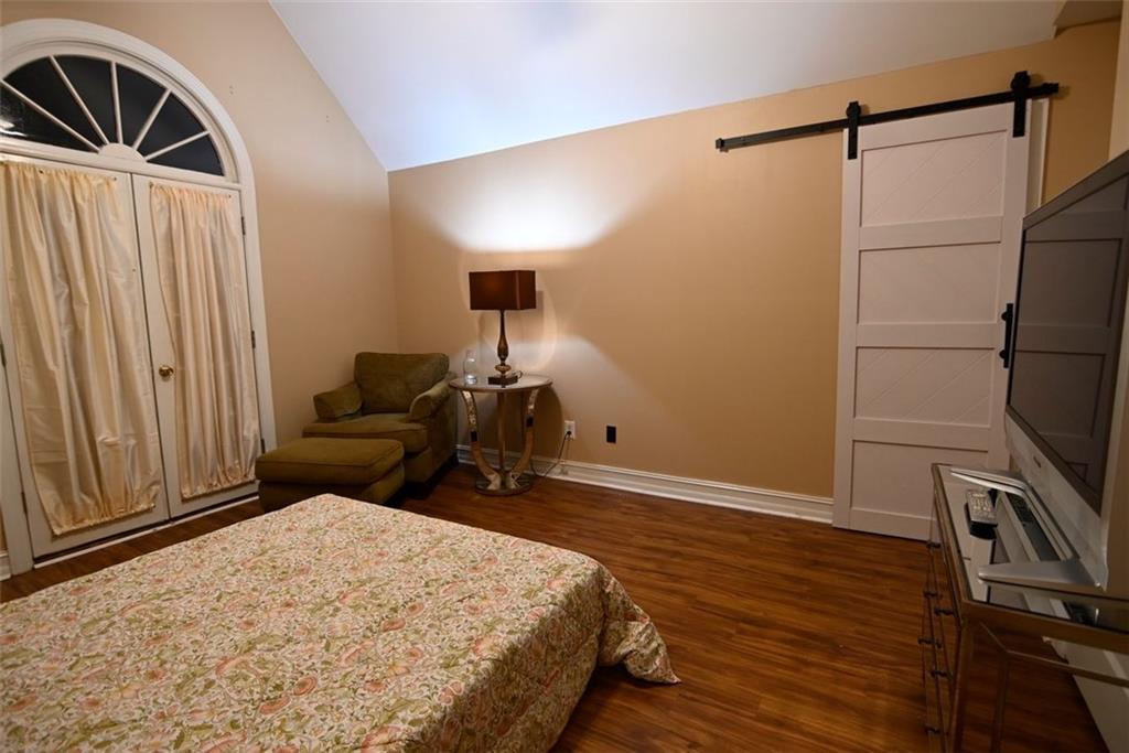 1015 Forest Overlook Trail Southwest Atlanta, GA 30331 - Photo 11 of 16 a bedroom with a bed and a dresser