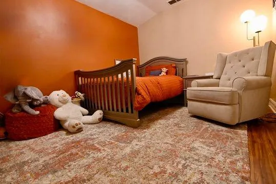 a bedroom with a bed and a couch