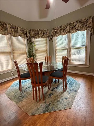 a view of a dining room with furniture and window