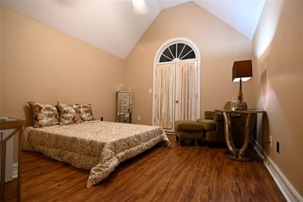 1015 Forest Overlook Trail Southwest Atlanta, GA 30331 - Photo 10 of 16 a bedroom with a bed and wooden floor