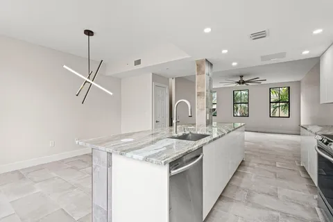 a kitchen with sink and window