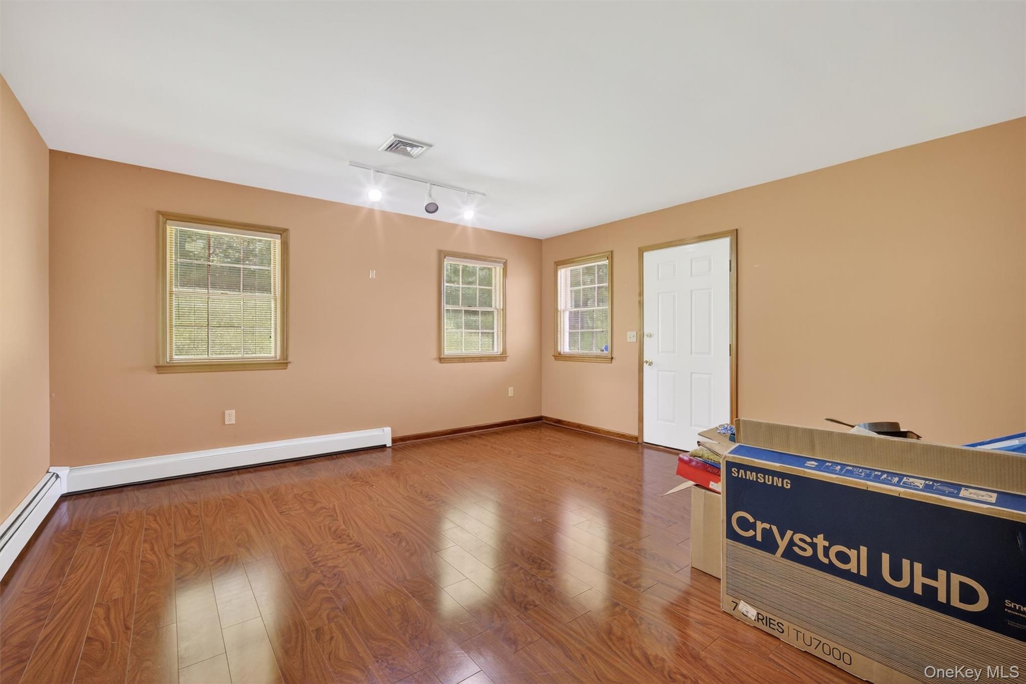 561 Toleman Road Rock Tavern, NY 12575 - Photo 14 of 31 a view of an empty room with wooden floor and a window