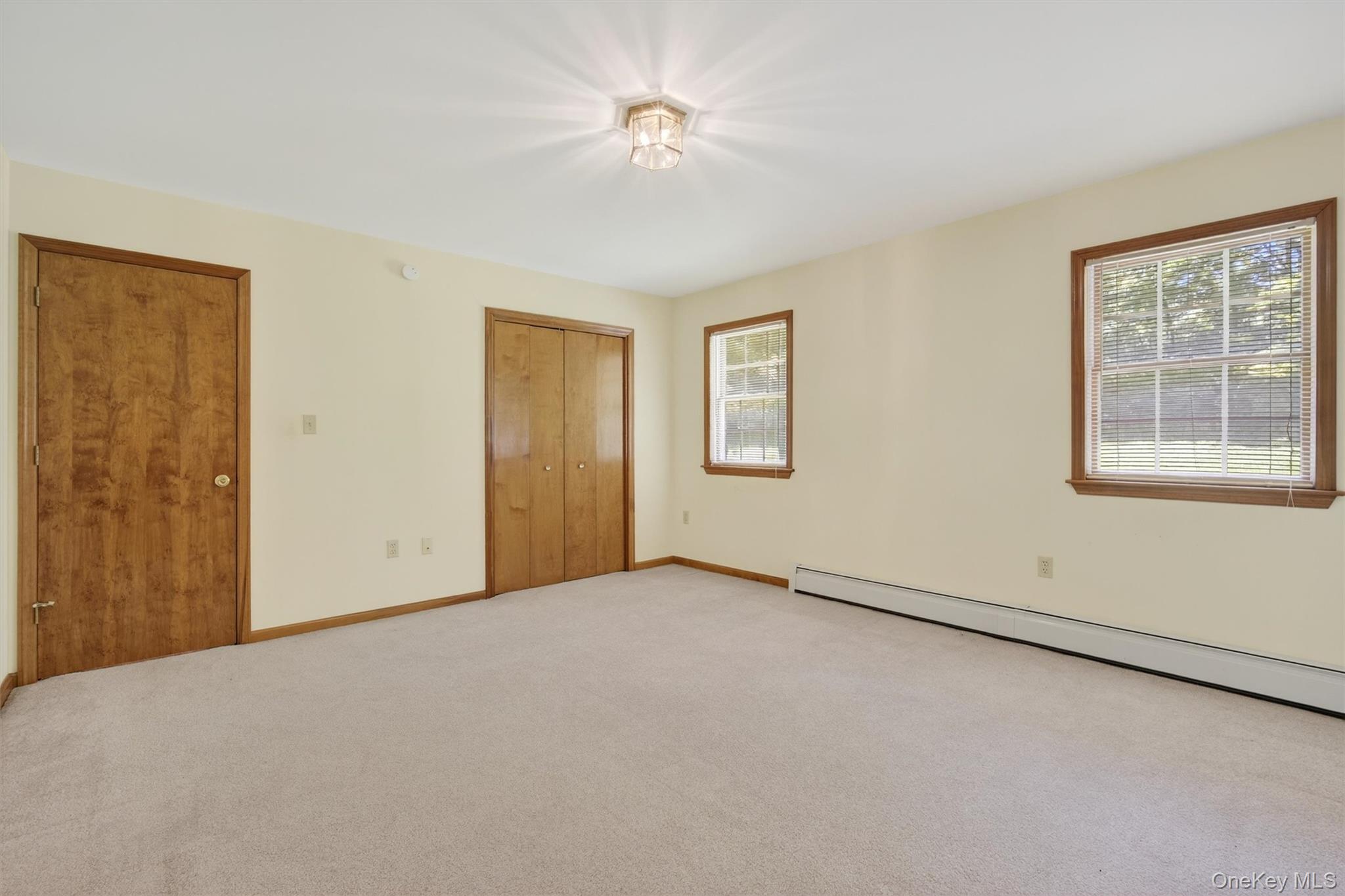 561 Toleman Road Rock Tavern, NY 12575 - Photo 20 of 31 an empty room with windows and closet