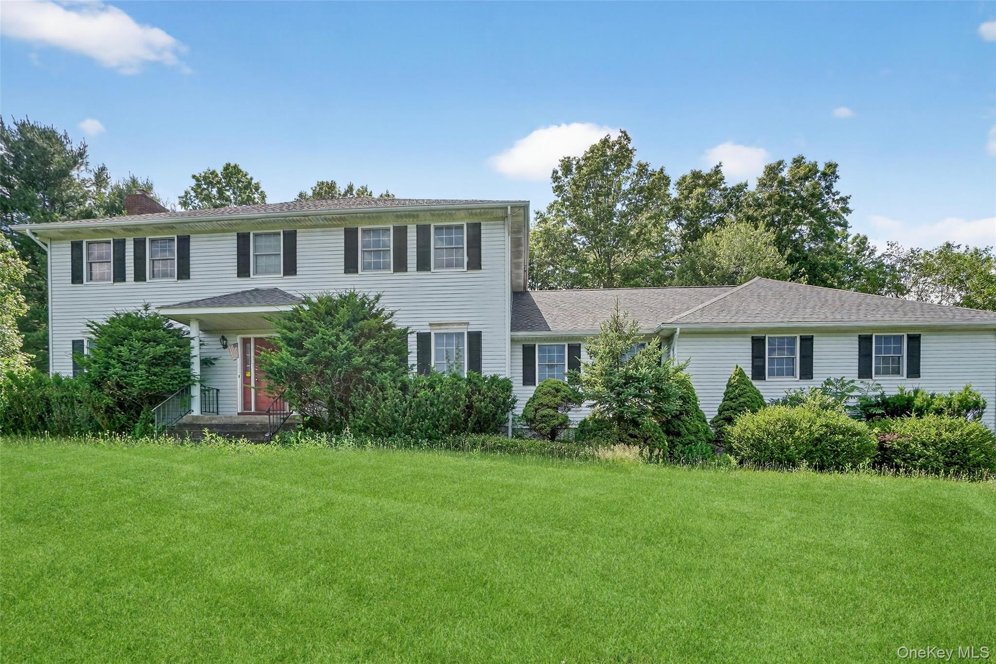 561 Toleman Road Rock Tavern, NY 12575 - Photo 2 of 31 a front view of a house with a yard and potted plants