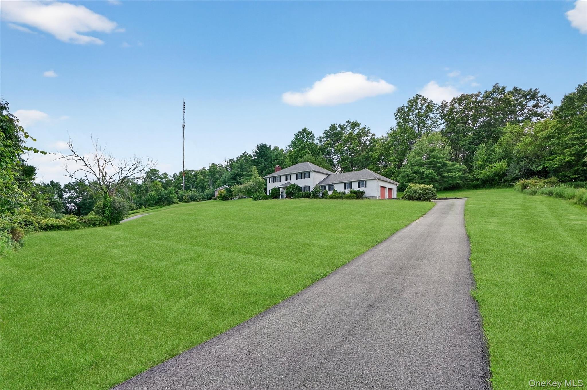 561 Toleman Road Rock Tavern, NY 12575 - Photo 3 of 31 a view of a garden with a building in the background