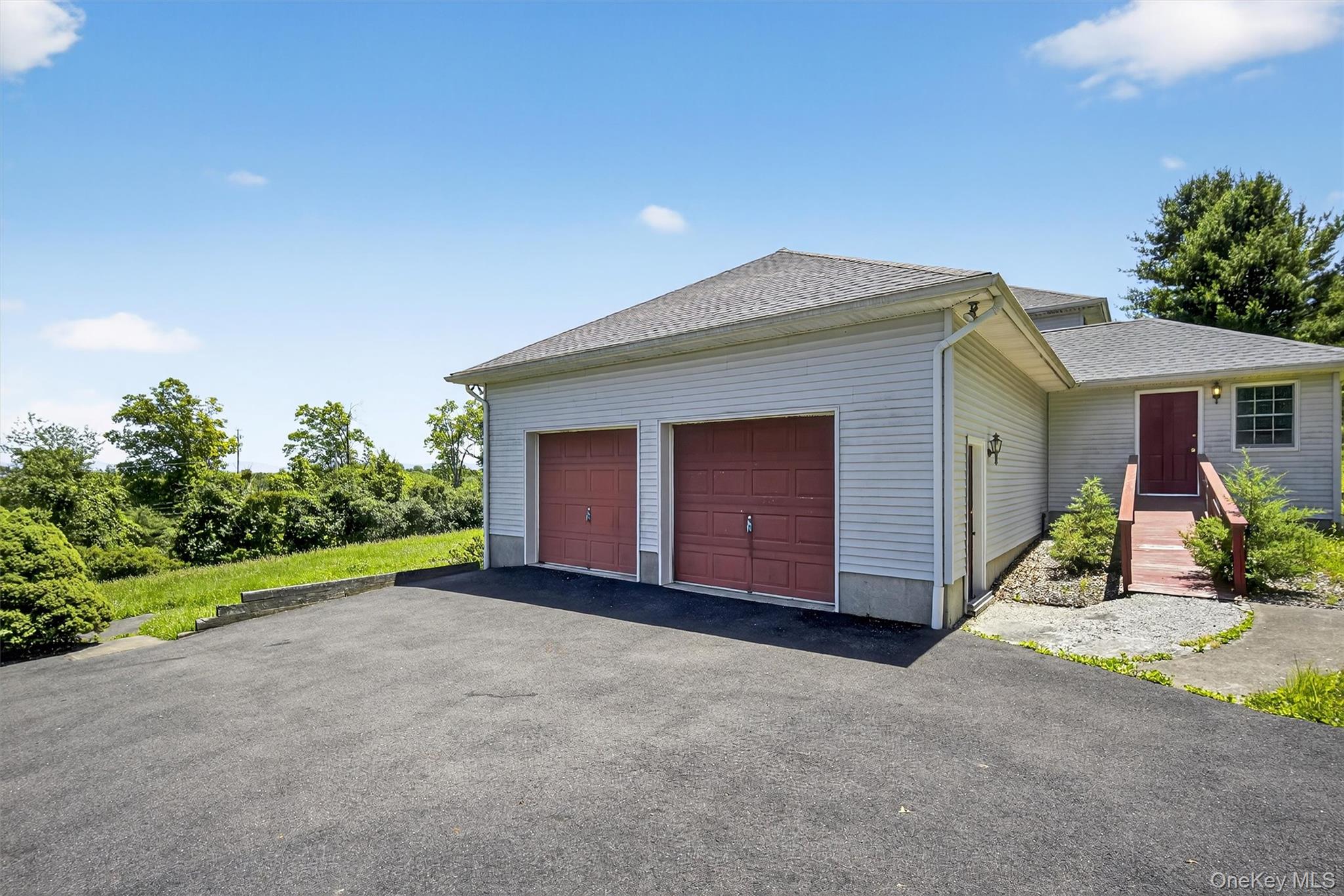 561 Toleman Road Rock Tavern, NY 12575 - Photo 4 of 31 a front view of house with garage and yard