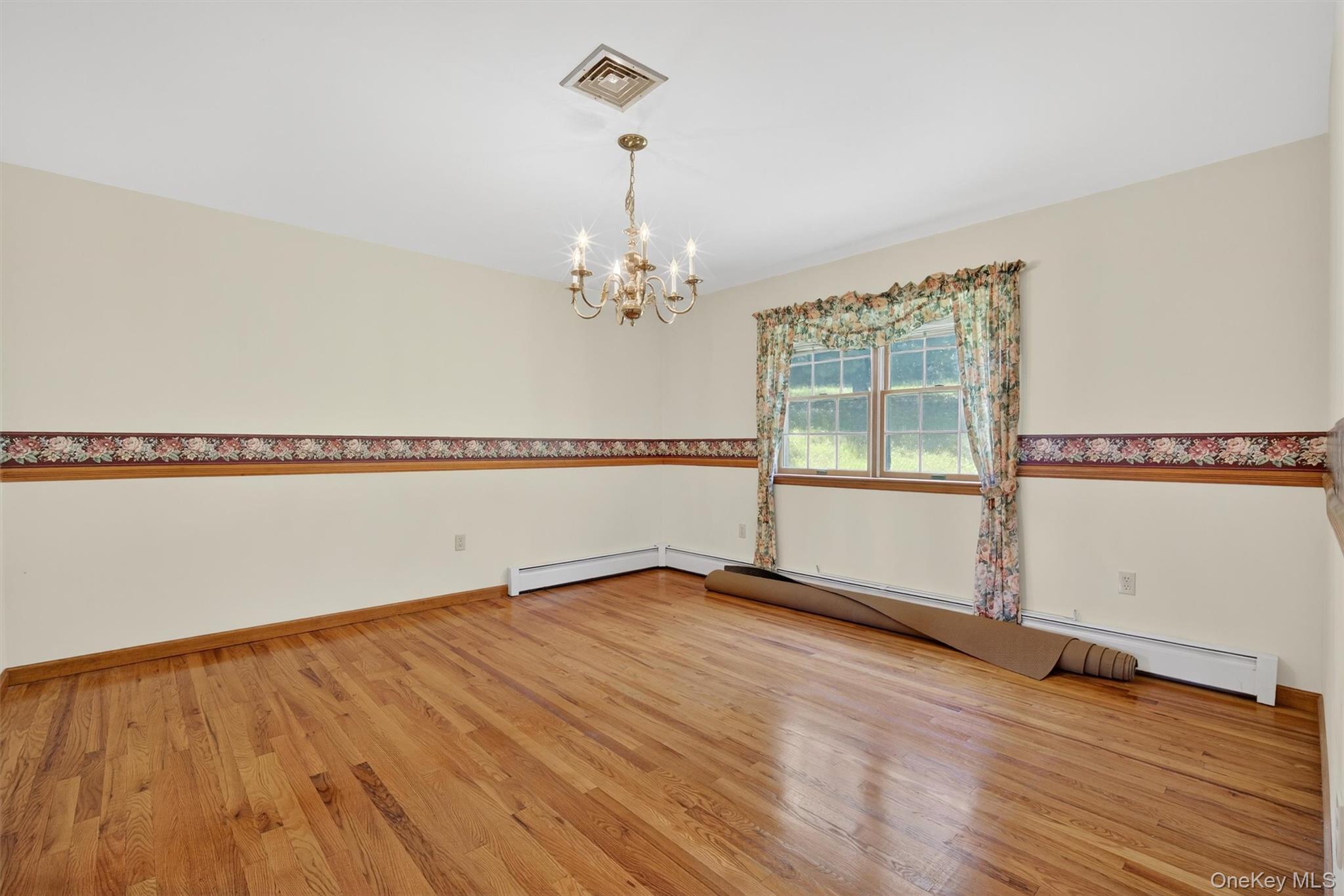 561 Toleman Road Rock Tavern, NY 12575 - Photo 9 of 31 a view of a room with wooden floor and fan