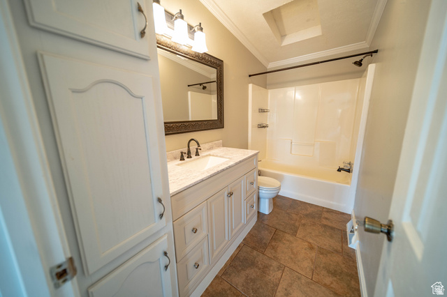 1407 North 1250th Street West Helper, UT 84526 - Photo 14 of 27 Full bath with vanity, crown molding, shower / bathtub combination, and dark tile patterned flooring
