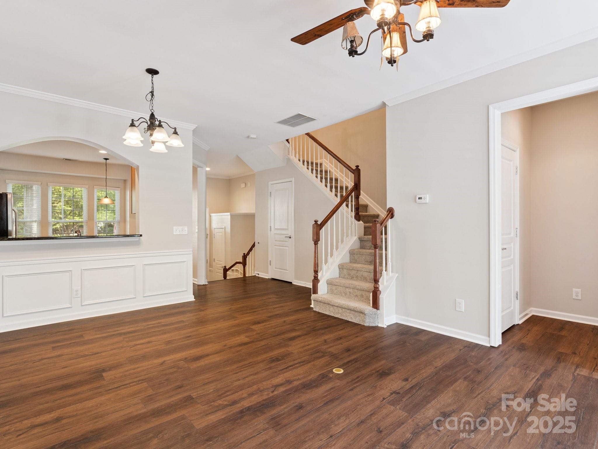 570 6th Baxter Crossing Fort Mill, SC 29708 - Photo 11 of 37 a view of empty room with wooden floor and fan