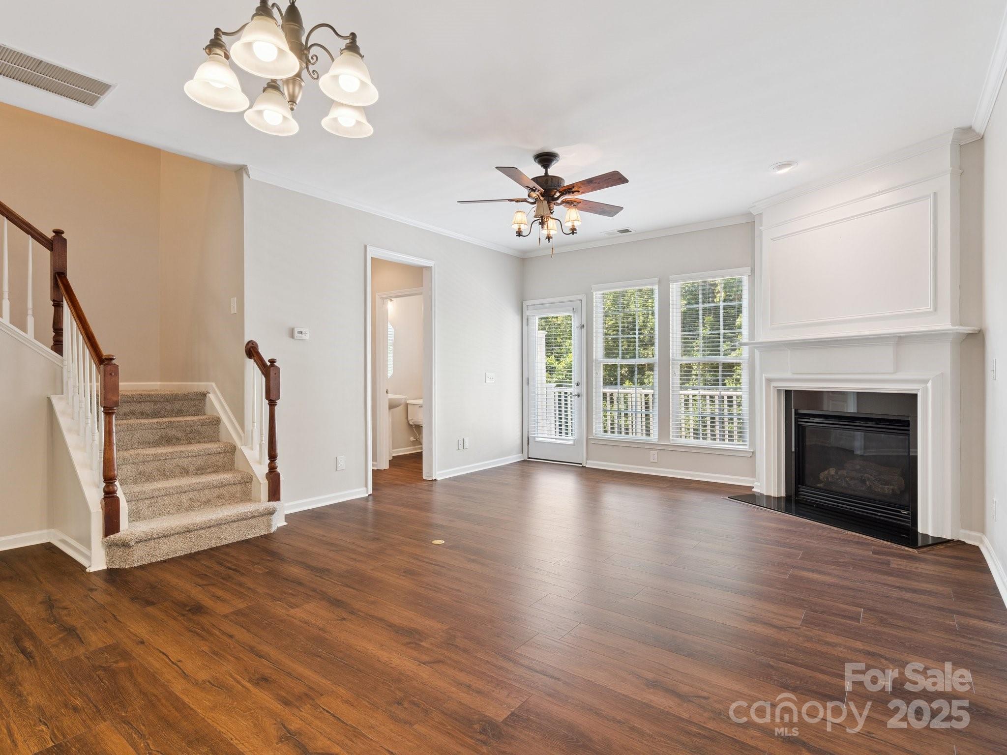 570 6th Baxter Crossing Fort Mill, SC 29708 - Photo 12 of 37 a view of an empty room with wooden floor and a window