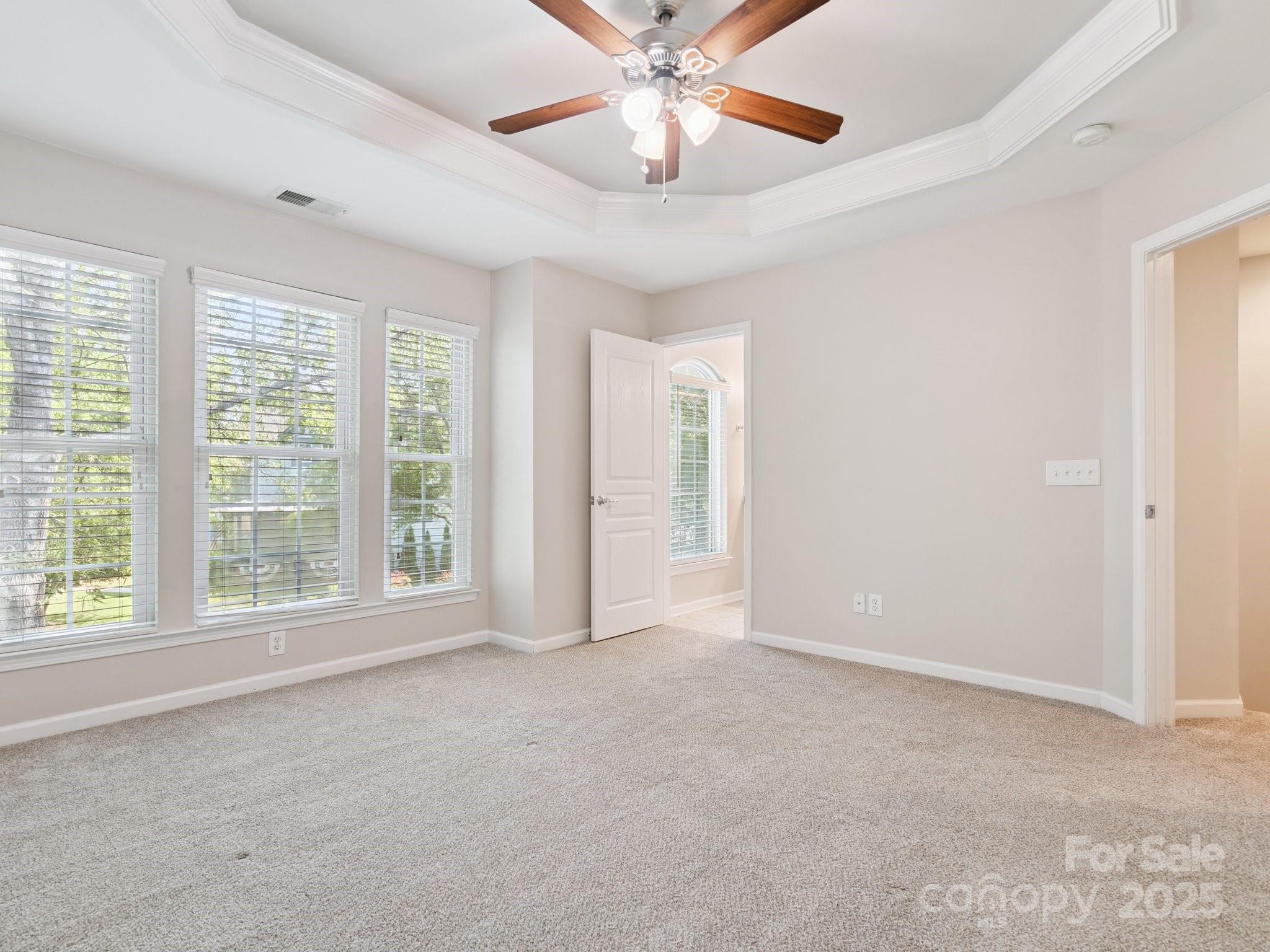 570 6th Baxter Crossing Fort Mill, SC 29708 - Photo 15 of 37 a view of an empty room with window and chandelier fan