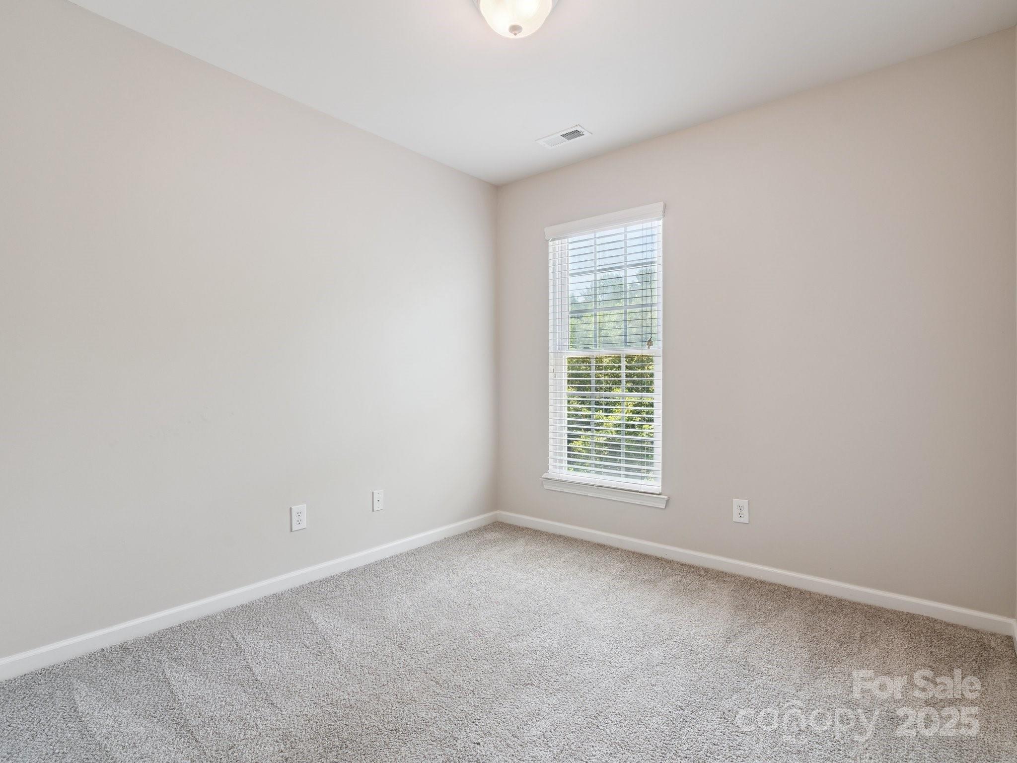 570 6th Baxter Crossing Fort Mill, SC 29708 - Photo 20 of 37 an empty room with a window