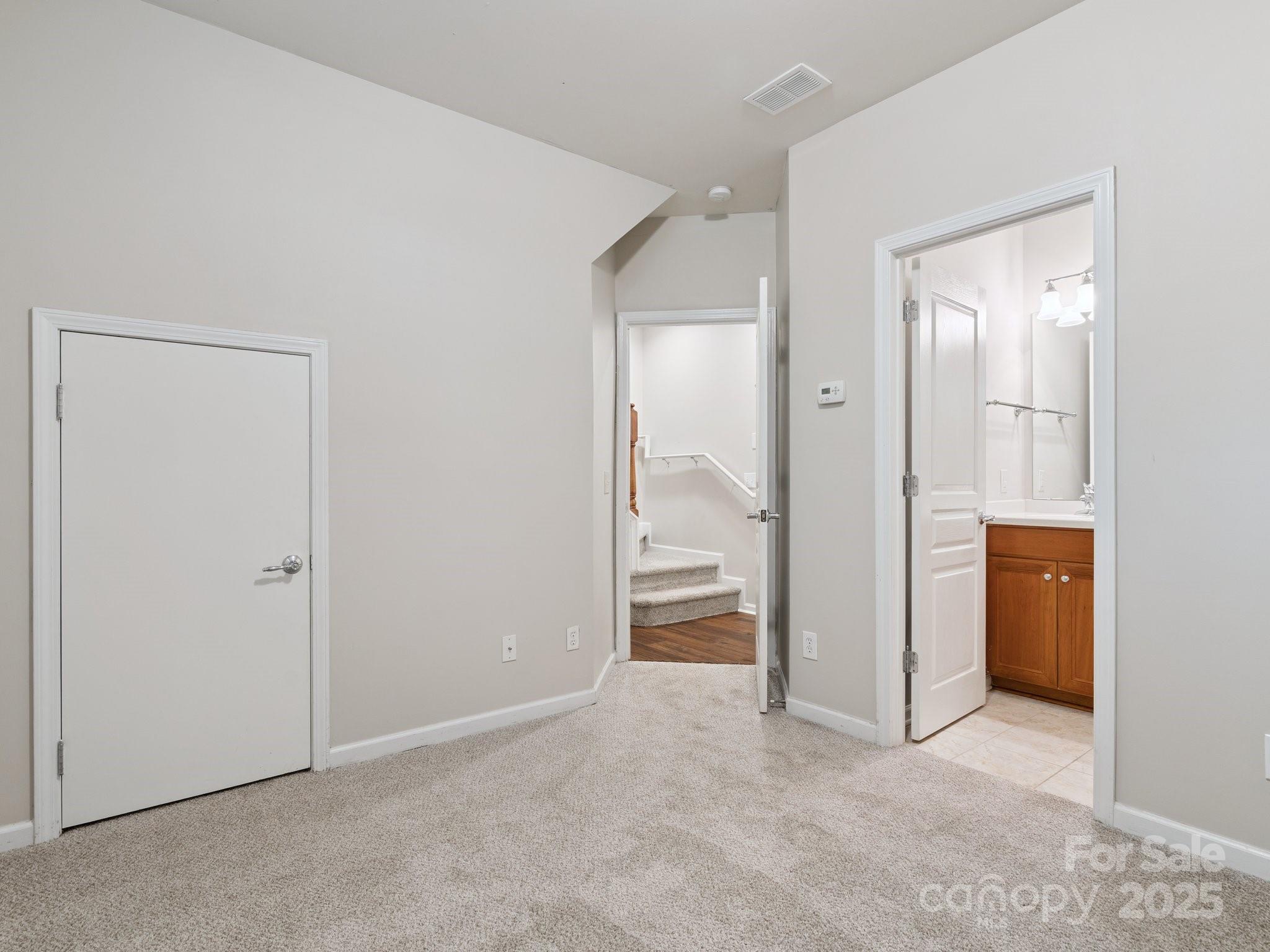 570 6th Baxter Crossing Fort Mill, SC 29708 - Photo 24 of 37 an empty room with mirror and a bathroom