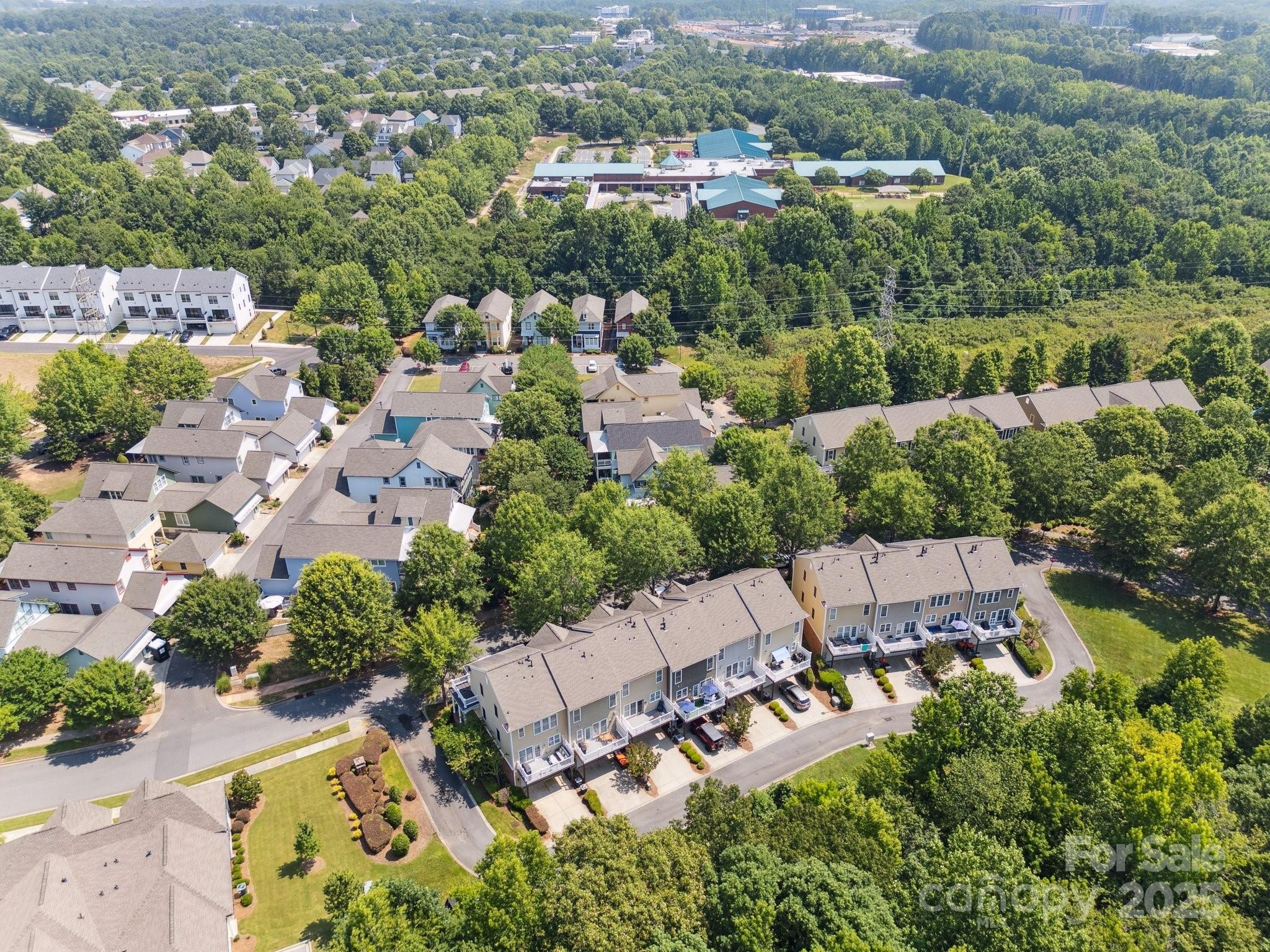 570 6th Baxter Crossing Fort Mill, SC 29708 - Photo 30 of 37 an aerial view of a house with a yard and lake view