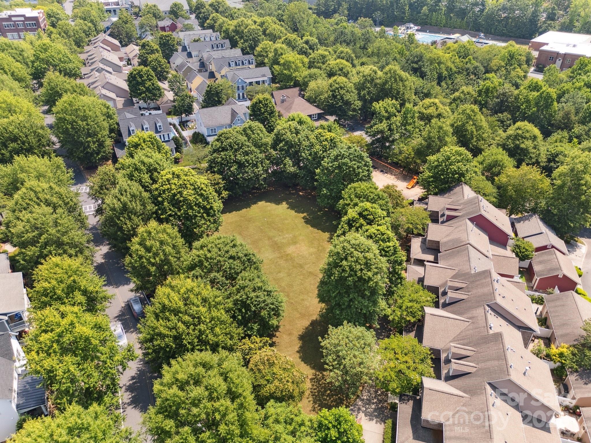 570 6th Baxter Crossing Fort Mill, SC 29708 - Photo 31 of 37 an aerial view of residential house with outdoor space and swimming pool