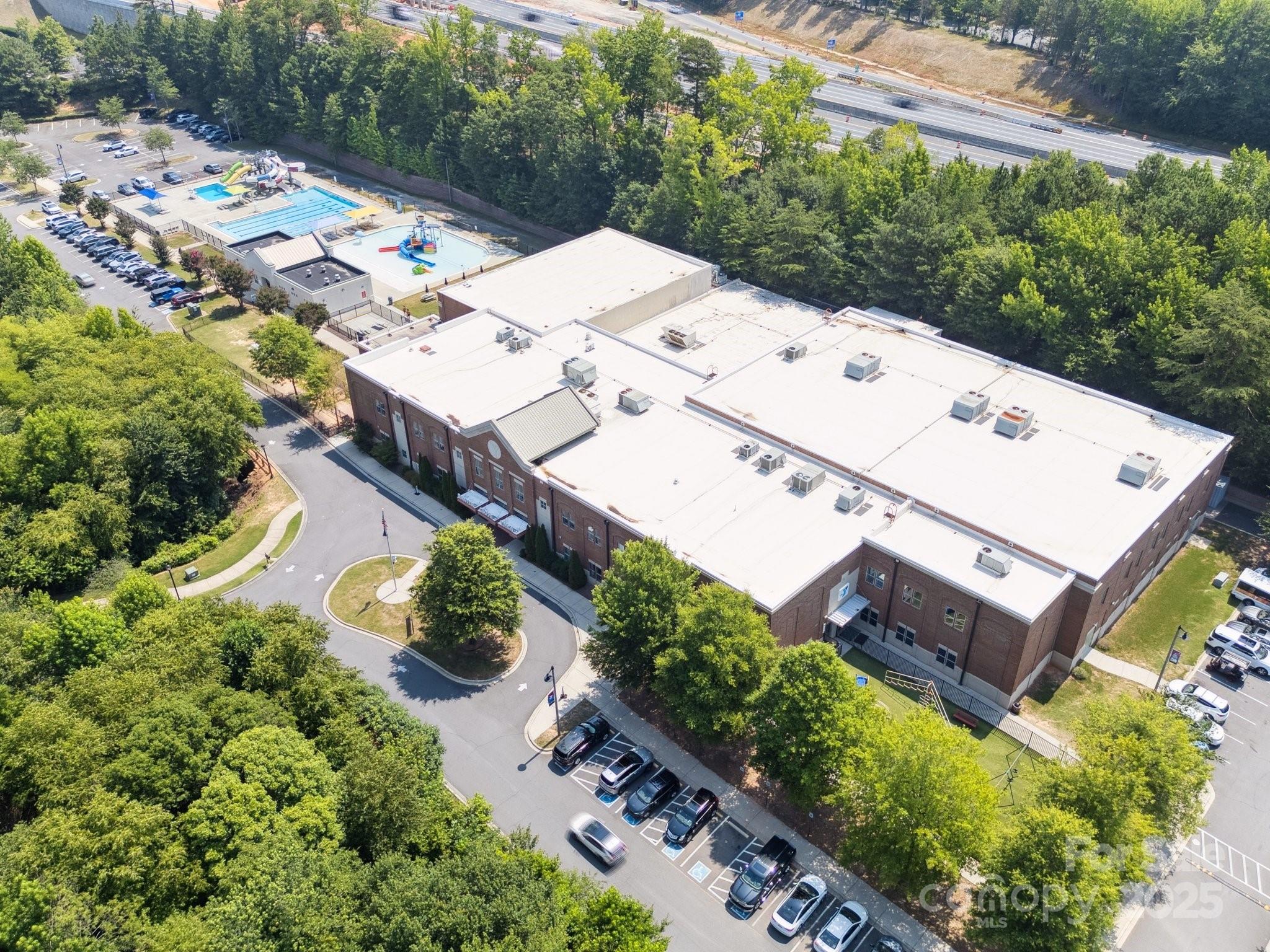 570 6th Baxter Crossing Fort Mill, SC 29708 - Photo 33 of 37 an aerial view of a house with a yard basket ball court and outdoor seating