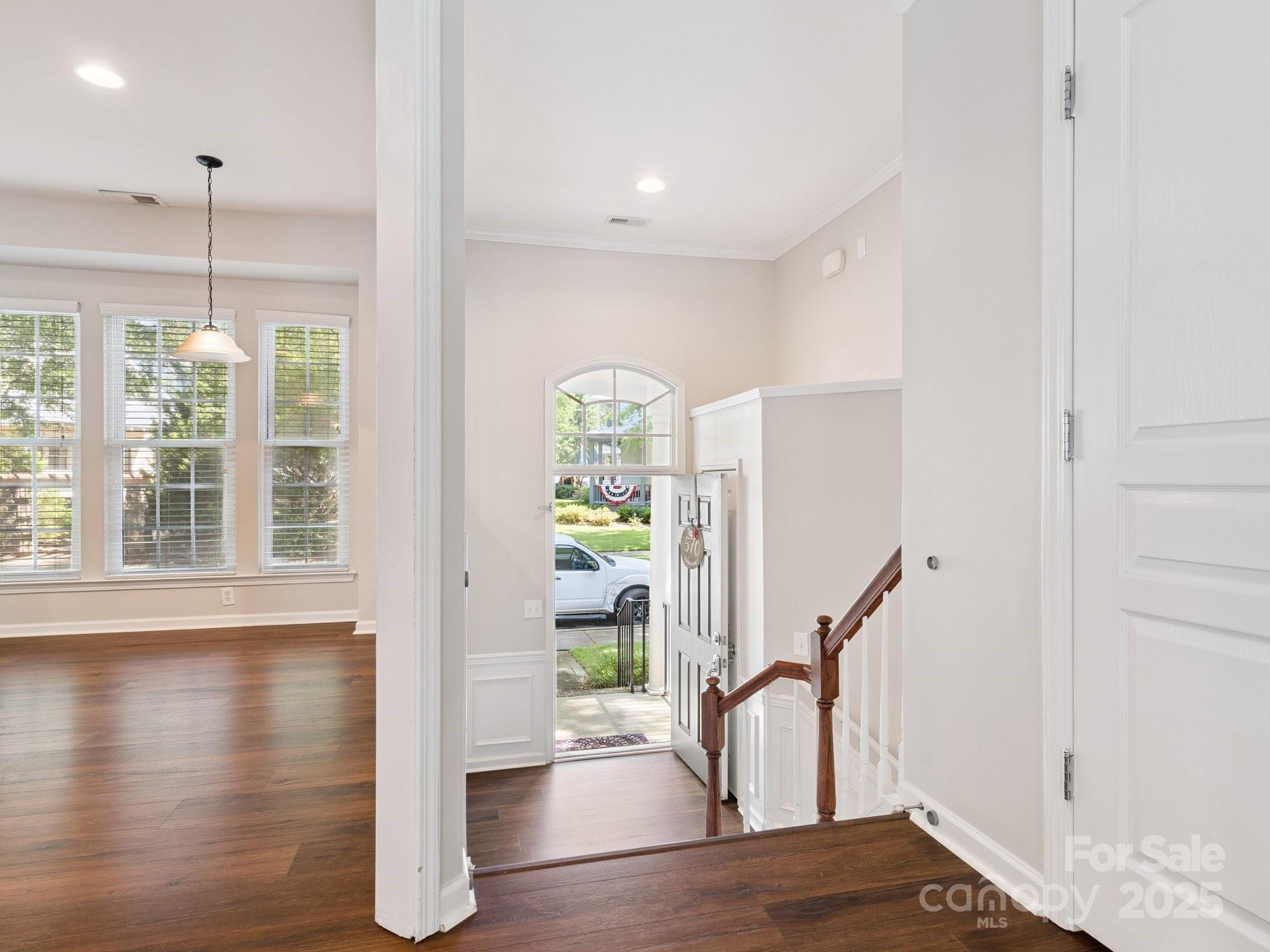 570 6th Baxter Crossing Fort Mill, SC 29708 - Photo 5 of 37 a view of empty room with wooden floor and fan