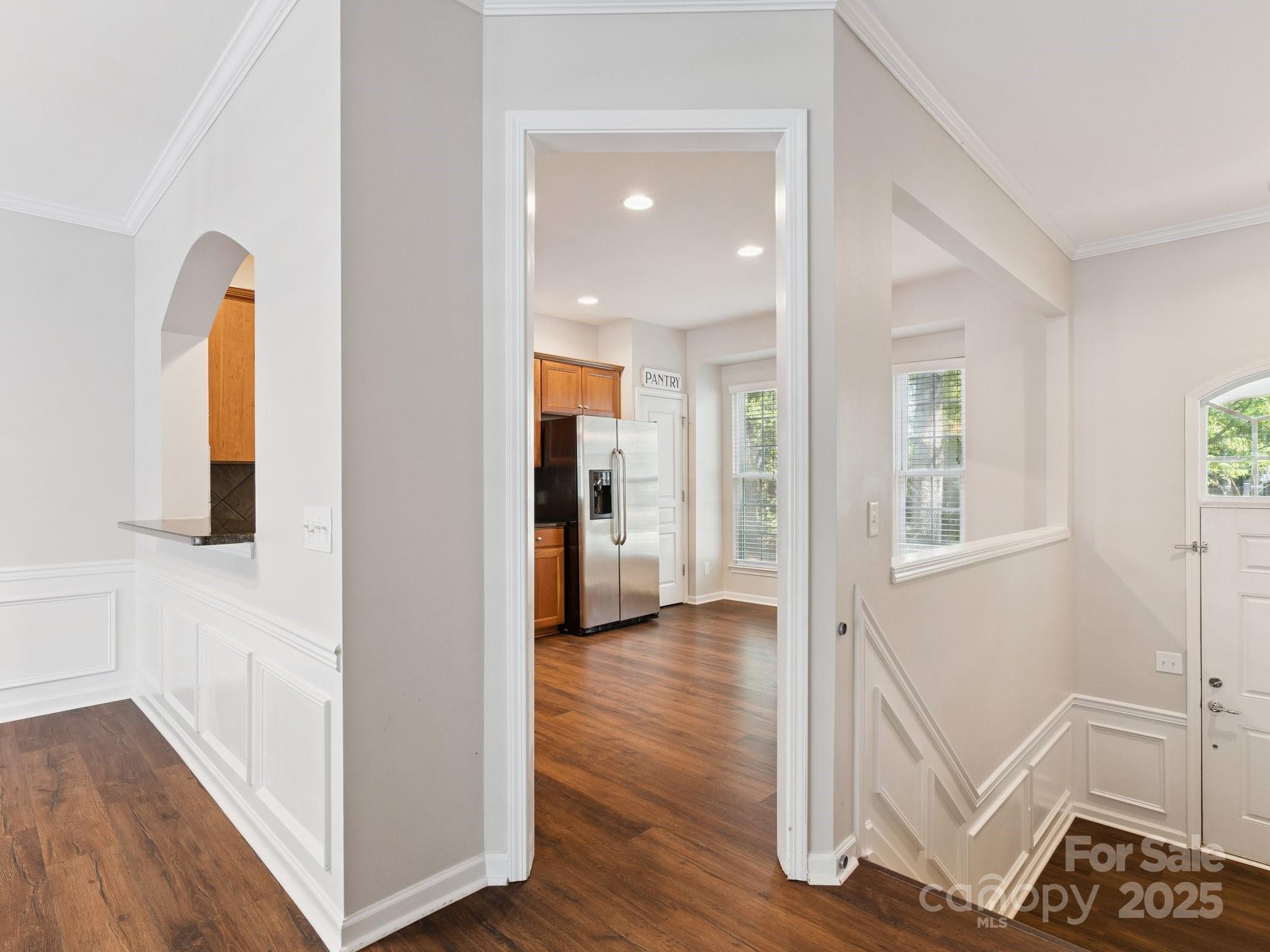 570 6th Baxter Crossing Fort Mill, SC 29708 - Photo 6 of 37 a view of a hallway with wooden floor and a bathroom