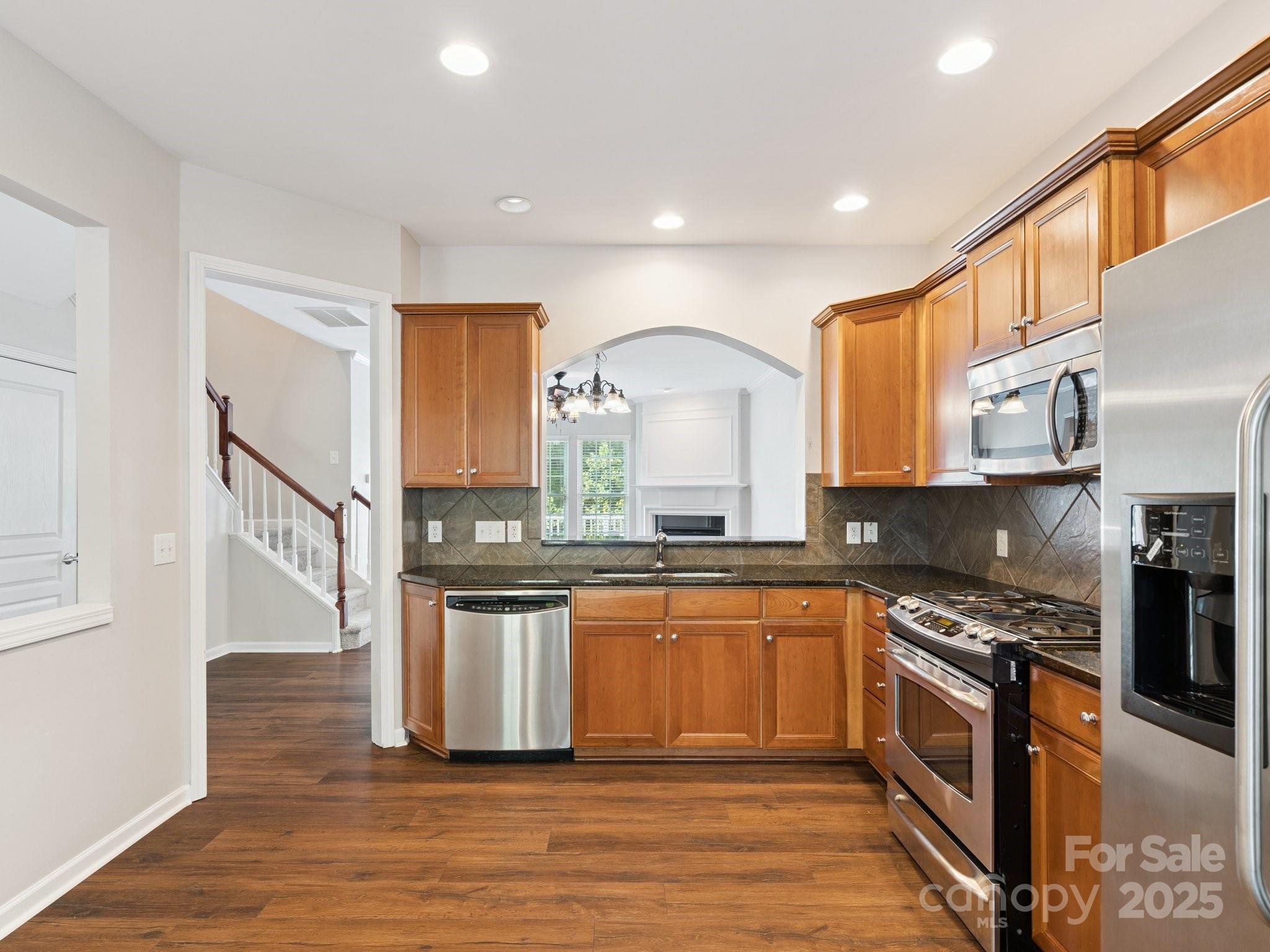 570 6th Baxter Crossing Fort Mill, SC 29708 - Photo 7 of 37 a kitchen with stainless steel appliances granite countertop a stove a sink and a microwave