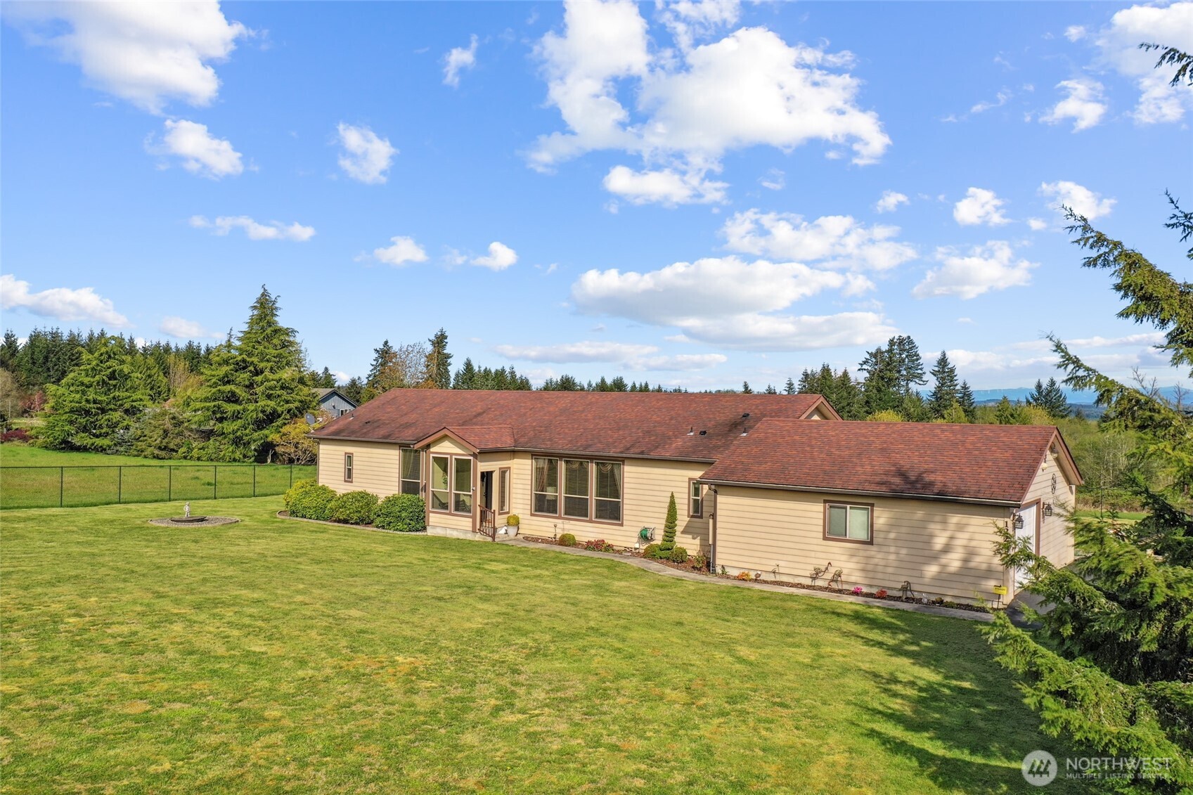 12245 Langworthy Road Southwest Rochester, WA 98579 - Photo 5 of 39 a front view of a house with a garden