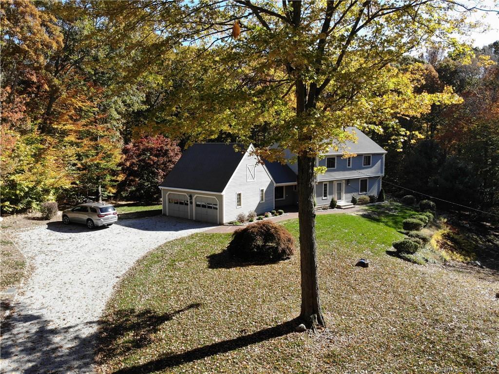 a view of house with yard