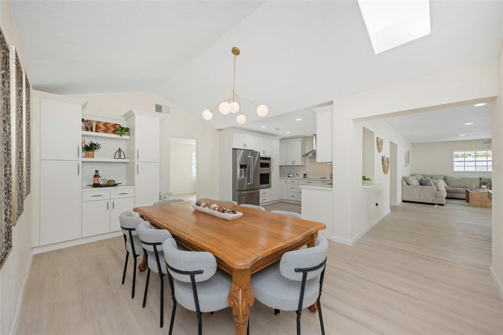 11419 47th Avenue North St. Petersburg, FL 33708 - Photo 21 of 94 a view of a dining room with furniture and wooden floor