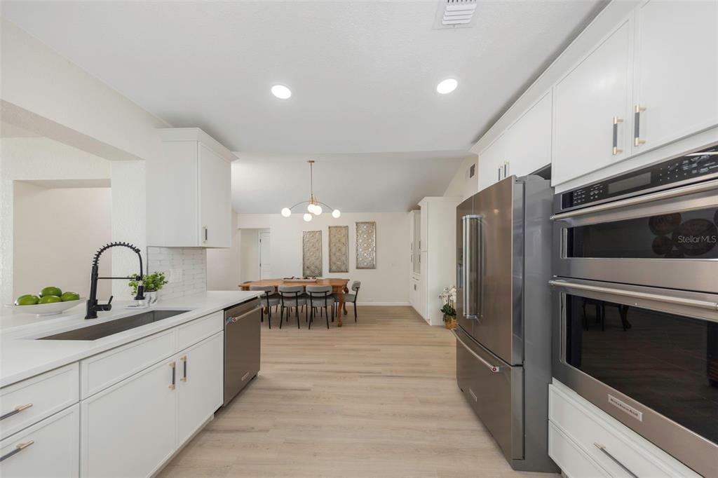 11419 47th Avenue North St. Petersburg, FL 33708 - Photo 27 of 94 a kitchen with sink cabinets and stainless steel appliances