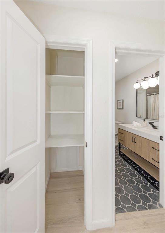 11419 47th Avenue North St. Petersburg, FL 33708 - Photo 38 of 94 a bathroom with a double vanity sink a mirror and a shower