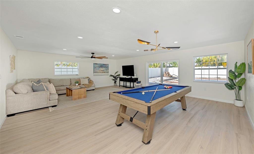 11419 47th Avenue North St. Petersburg, FL 33708 - Photo 45 of 94 a living room with furniture and a flat screen tv