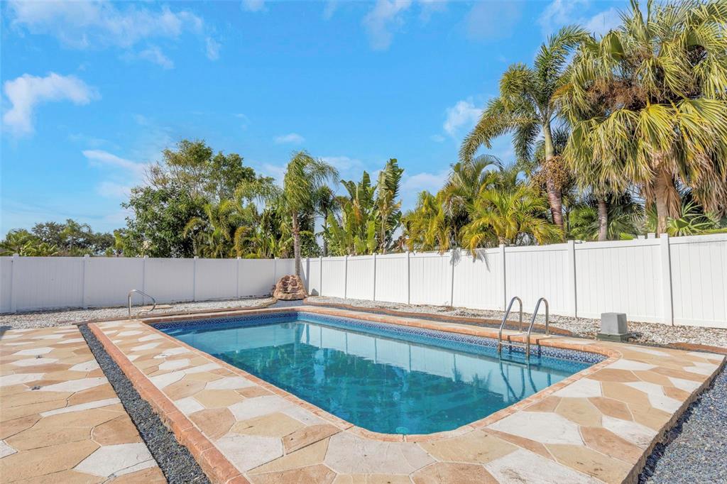 11419 47th Avenue North St. Petersburg, FL 33708 - Photo 68 of 94 a view of a swimming pool with a chair